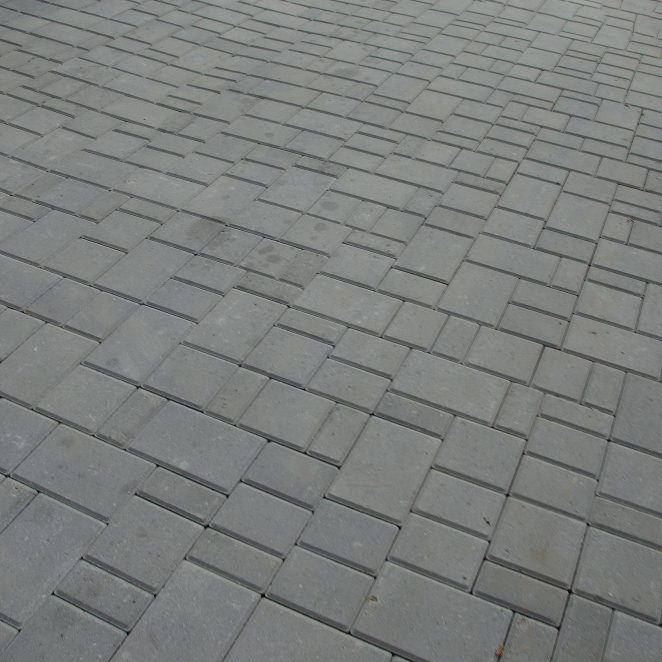 Grey block paving laid in herringbone