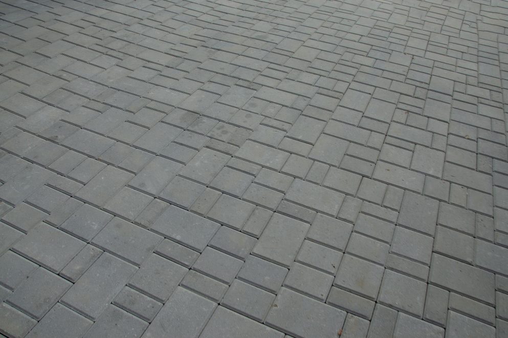 Grey block paving laid in herringbone