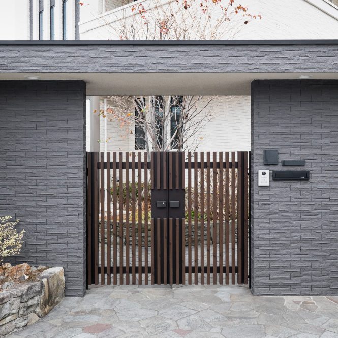 Timber and steel driveway gates on a modern house