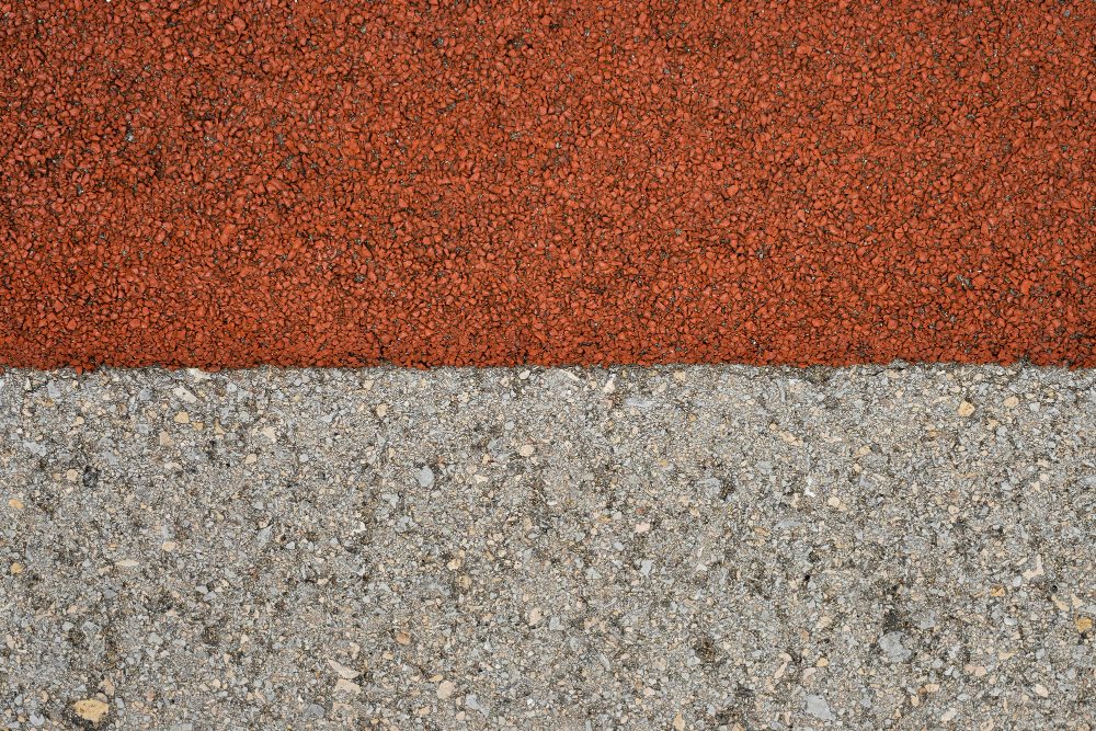 Red and grey bound aggregate surface close-up