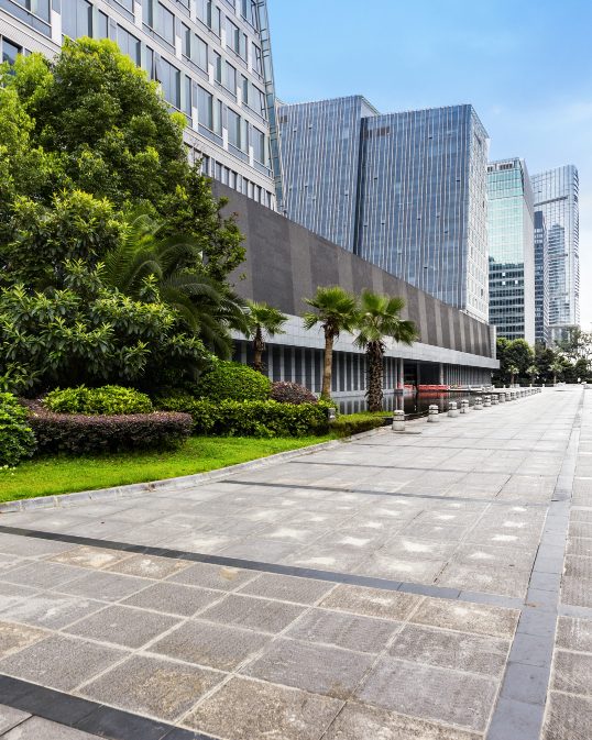 Paved path running through grass