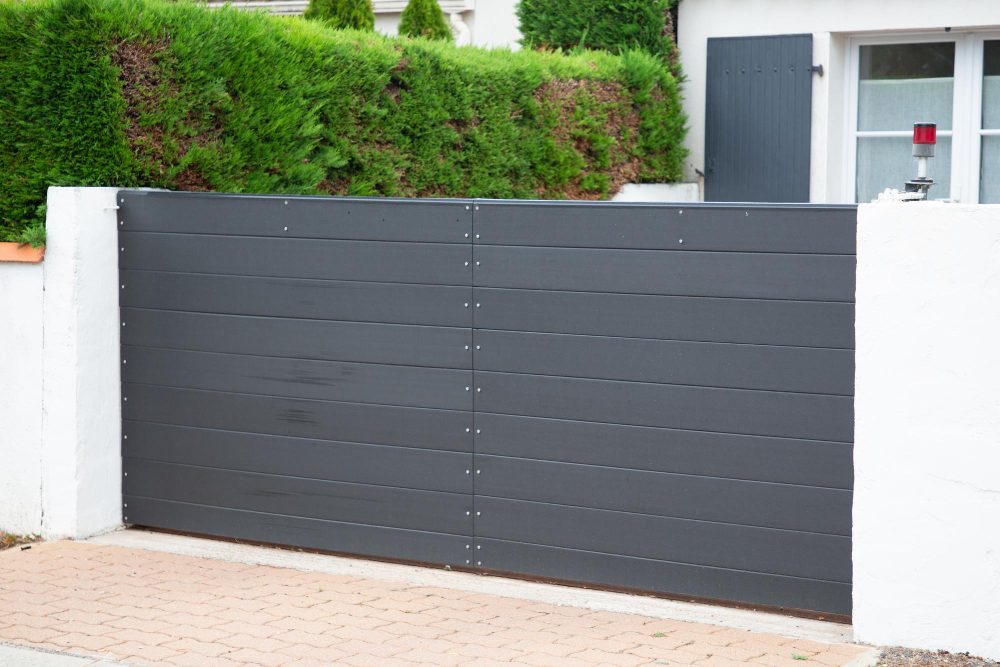 Grey sliding gate on a driveway